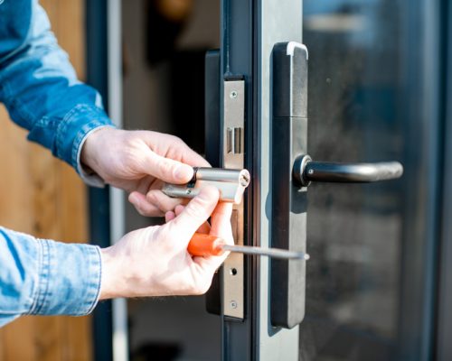 Man,Changing,Core,Of,A,Door,Lock,Of,The,Entrance Man,Changing,Core,Of,A,Door,Lock,Of,The,Entrance